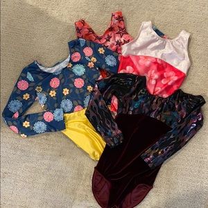 Four size Medium gymnastics leotards